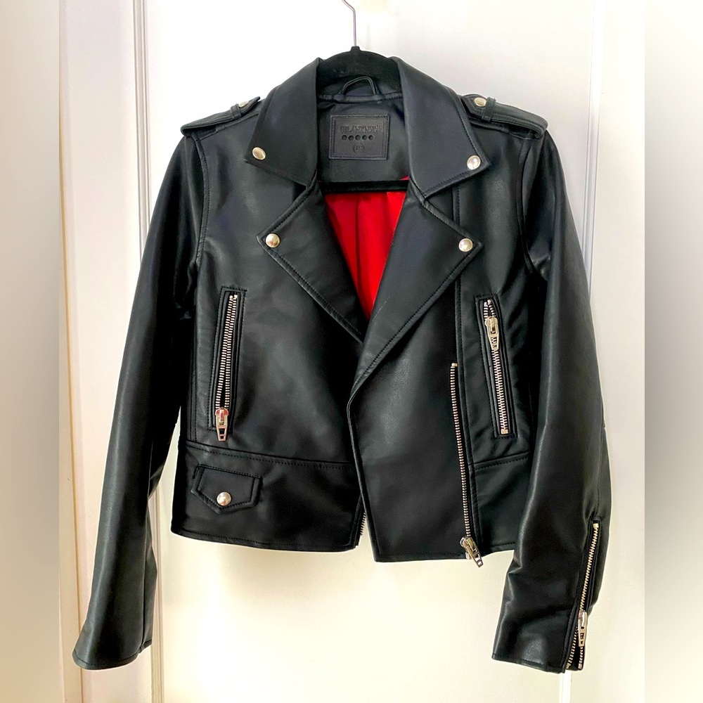 Moto Jacket XS Women’s. Excellent condition. Faux Leather with Red Satin lining.